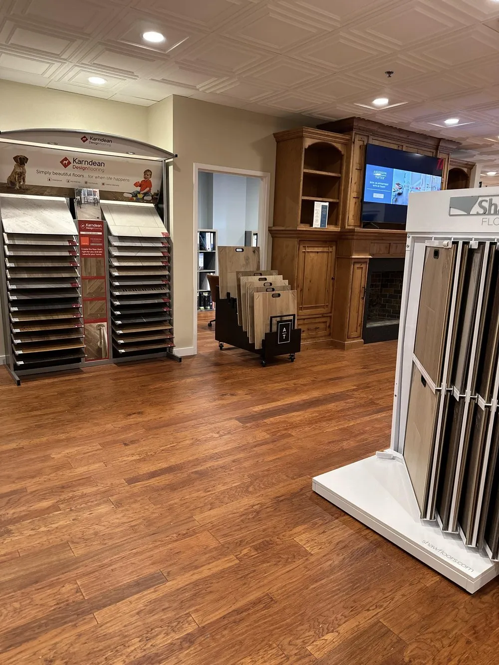 Luxury vinyl displays and a hardwood floor in the Cherry Hill showroom.
